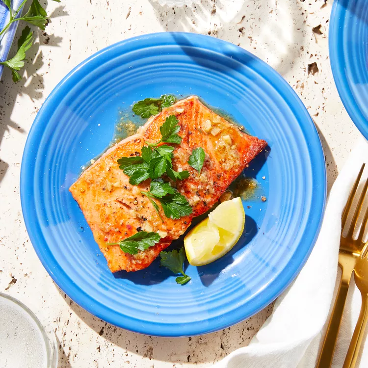 Lemon Garlic Salmon on a blue plate
